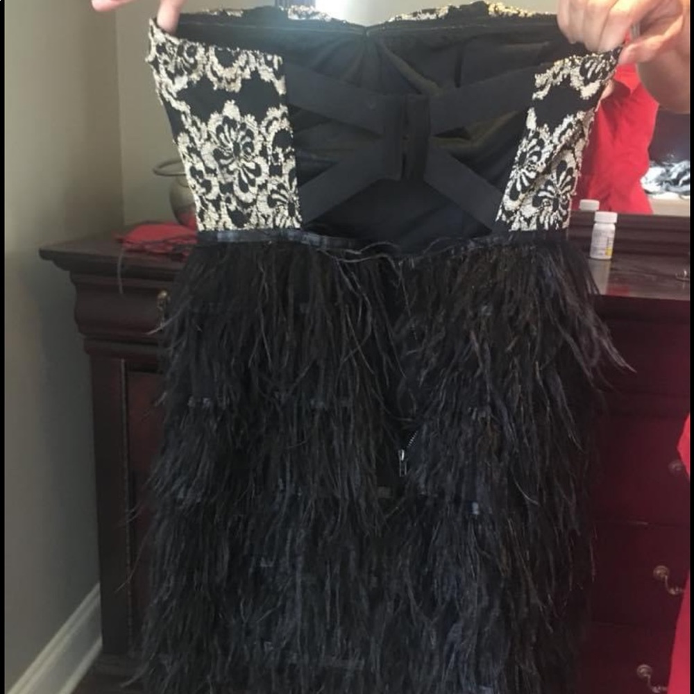 Feathered gold and black dress
